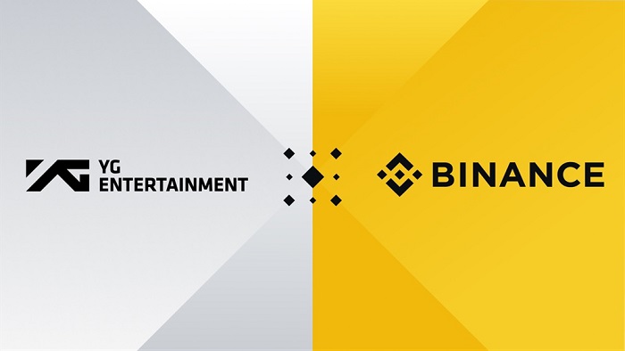 This composite photo provided by YG Entertainment shows logos of the K-pop agency and global blockchain and cryptocurrency infrastructure provider Binance.