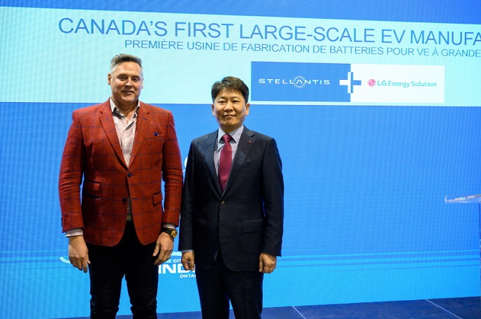 Stellantis COO Mark Stewart (L) and LG Energy Solution's head of advanced automotive battery division Kim Dong-myung pose for photos at the ceremony announcing their joint venture to build an EV battery plant in Ontario, Canada, on March 23, 2022, in this file photo provided by LGES.