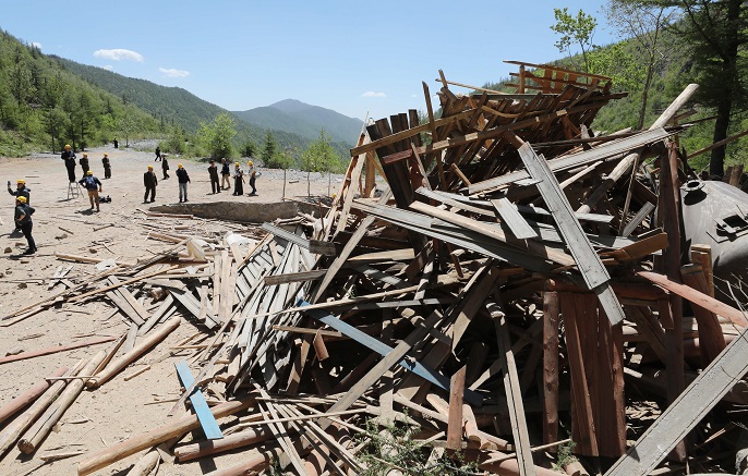 In this press pool file photo, debris is piled up after Tunnel No. 2 of North Korea's only known nuclear test site Punggye-ri is blown up on May 24, 2018. (Yonhap)