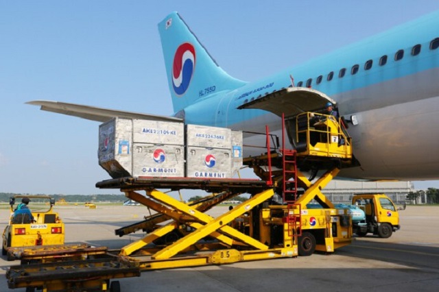 This photo taken on Aug. 6, 2020, shows cargo being loaded on a Korean Air A330 jet at a local airport. (Yonhap)