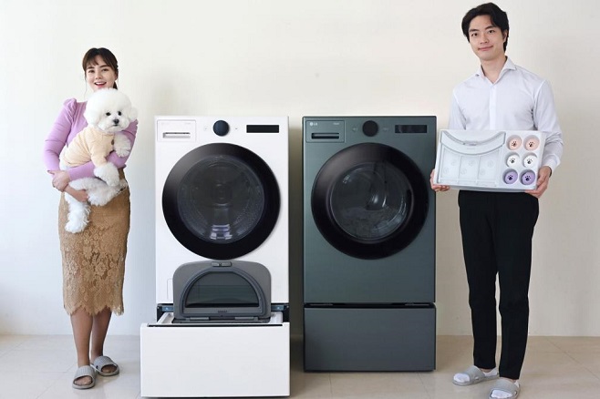 his photo provided by LG Electronics Inc. shows models introducing the company's new washer highlighting pet care functions.