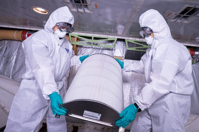 Engineers replace a HEPA (high-efficiency particulate air) filter from a Boeing 747-8i plane at its hangar in Seoul on July 27, 2020, in a special inspection of the airplane's air circulation systems and HEPA filters. (Yonhap)