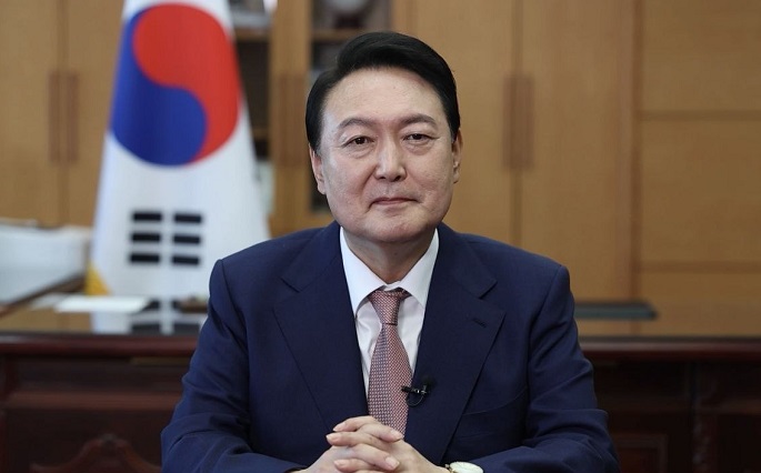 President Yoon Suk-yeol takes part in an online global summit at the presidential office in Seoul on May 12, 2022, about efforts to tackle the coronavirus pandemic, in this screenshot released by the office. 