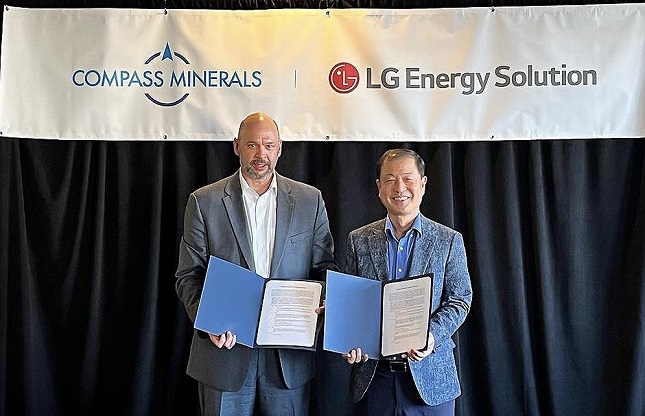 Kim Dong-soo (R), senior vice president at LG Energy Solution, poses for a photo with Chris Yandell, senior vice president and head of lithium at Compass Minerals, during a signing event for their supply deal in the United States on June 28, 2022, in this photo provided by LGES two days later.