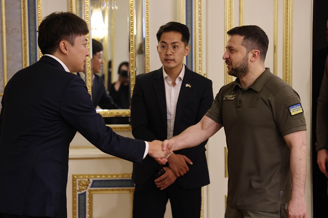 This photo, captured from the Facebook account of Lee Jun-seok, head of South Korea's ruling People Power Party on June 7, 2022, shows Lee (L) meeting Ukrainian President Volodymyr Zelenskyy on June 6, 2022.
