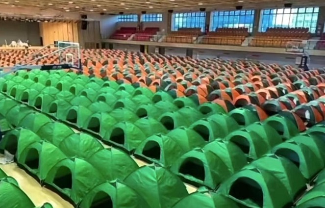 Makeshift tents are set up inside a gymnasium at SK hynix's factory in Wuxi, China, in this photo captured from an online video on the popular Chinese messaging application WeChat. 
