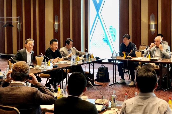 In this photo provided by CJ CheilJedang, CEO Choi Eun-seok (L) and other company officials attend a meeting held in Frankfurt, Germany, on June 30, 2022. 