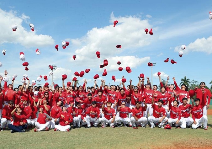 This file photo provided by the Kia Tigers on March 16, 2020, shows members of the Tigers celebrating the end of their spring training in Fort Myers, Florida. 