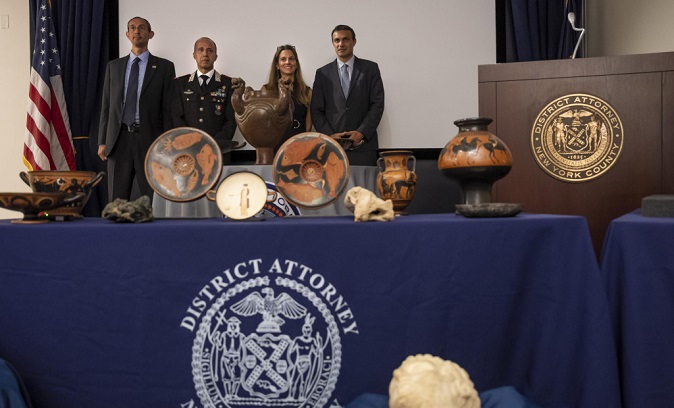 Mike Alfonso, Assistant Special Agent in Charge, Homeland Security Investigations, Consul General of Italy in New York, Fabrizio Di Michele, Executive Assistant District Attorney of New York County Lisa Delpizzo and General Roberto Riccardi of the Carabinieri Command for the Protection of Cultural Heritage pose for a photo during a news conference and repatriation ceremony, announcing the return of stolen antiquities to Italy, on Tuesday, Sept, 6, 2022, in New York