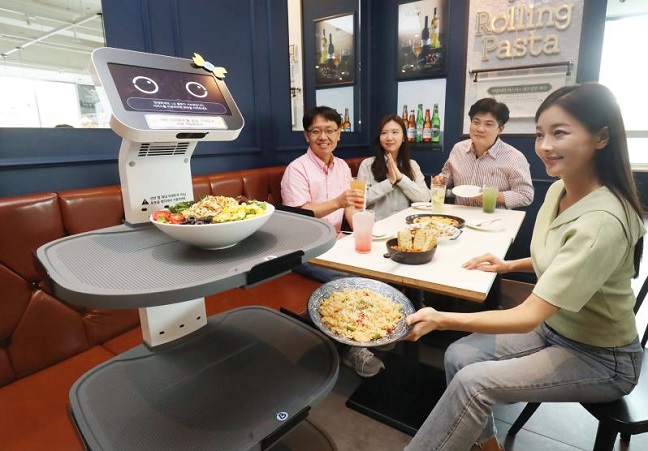 This photo taken on Sept. 22, 2022, and provided by LG Electronics Inc. shows the company's serving robot at a restaurant in Seoul.