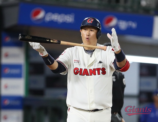 Lee Dae-ho of the Lotte Giants tosses his bat after hitting a grand slam against the Samsung Lions during the bottom of the third inning of a Korea Baseball Organization regular season game at Sajik Stadium in Busan, 325 kilometers southeast of Seoul, on Aug. 26, 2022, in this photo provided by the Giants.