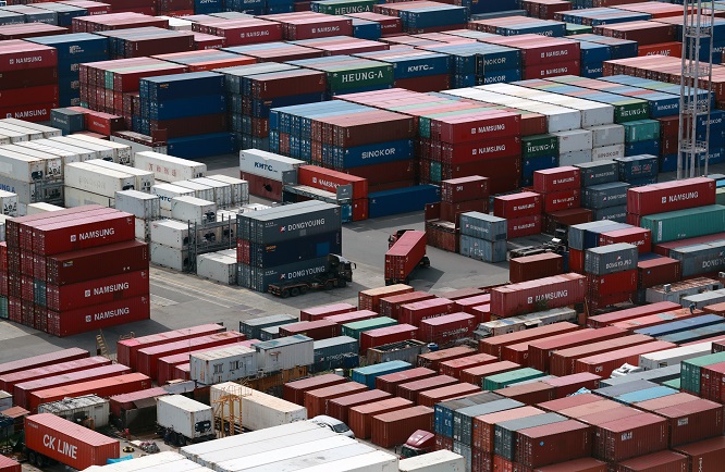 Containers for exports and imports are stacked at a pier in South Korea's largest port city of Busan on Sept. 13, 2022. (Yonhap)