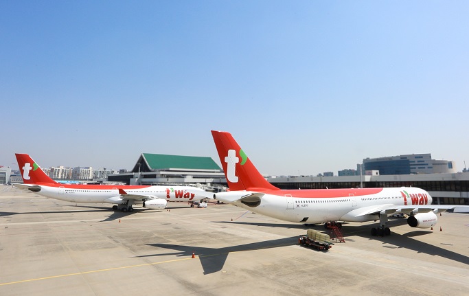 This file photo provided by T'way Air shows its A330-300 chartered planes at Incheon International Airport, west of Seoul.
