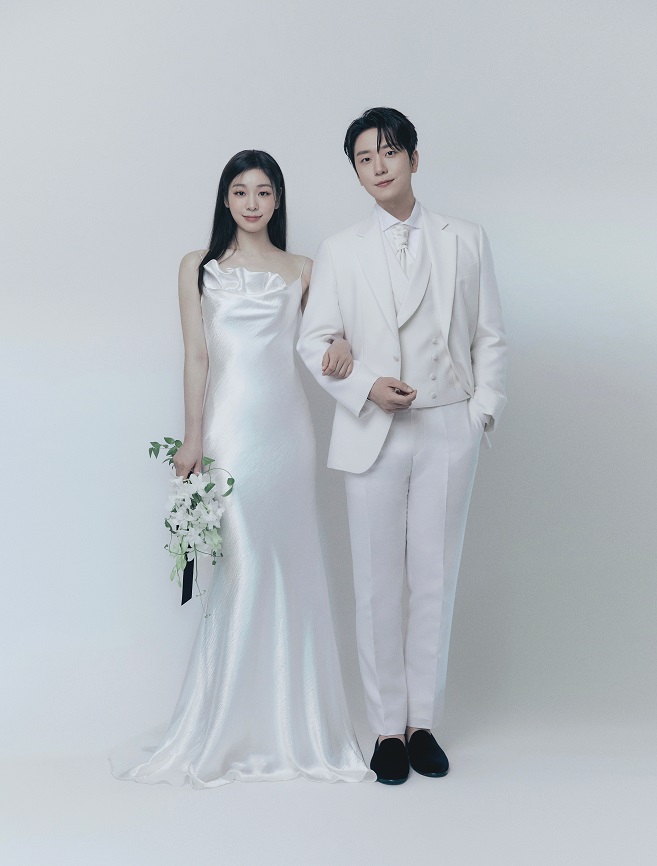This pre-wedding photo released by All That Sports on Oct. 22, 2022, shows South Korean former figure skater Kim Yu-na (L) and South Korean classical singer Ko Woo-rim.