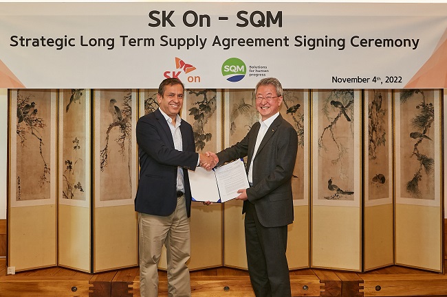 This photo taken on Nov. 4, 2022, and provided by SK On shows the company's Chief Operating Officer Jin Kyo-won (R) shaking hands with SQM Executive Vice President Carlos Diaz after signing a five-year lithium supply deal at SK Group's headquarters building in central Seoul. 