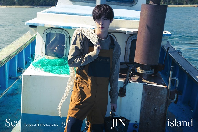 This image provided by Big Hit Music is from BTS member Jin's upcoming photo book, titled "Sea of JIN Island."