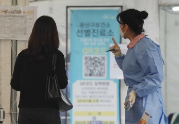 S. Korea’s New COVID-19 Cases Fall Below 50,000 amid ‘Twindemic’ Worries