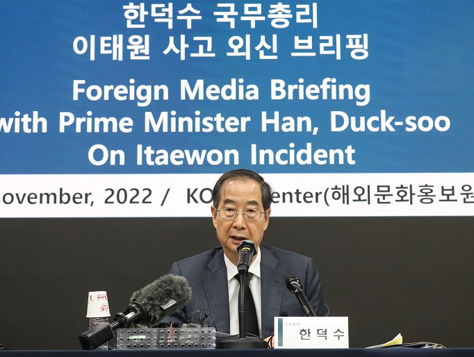 South Korean Prime Minister Han Duck-soo speaks during a meeting with foreign correspondents at the Press Center in Seoul on Nov. 1, 2022, over the Itaewon tragedy, in this photo provided by Han's office.
