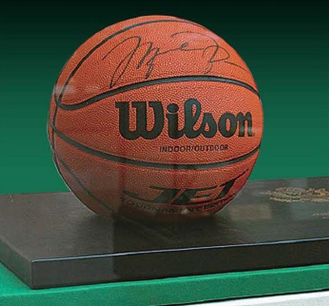 This photo, captured from the website of North Korea's Foreign Languages Publishing House on Jan. 30, 2023, shows a photo of a basketball signed by Michael Jordan, in a photo book of gifts given to the country's former leader Kim Jong-il. (Yonhap)