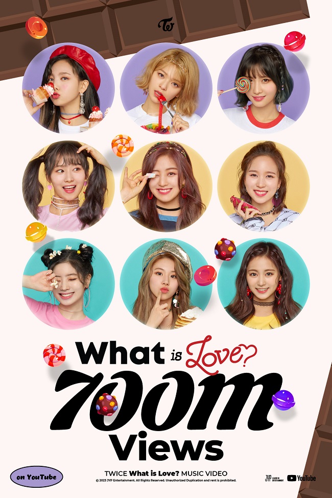 This photo provided by JYP Entertainment on Feb. 15, 2023, shows a poster celebrating TWICE's "What is Love?" music video surpassing 700 million YouTube views.