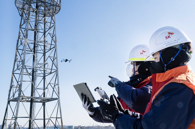 Engineers from a subsidiary of SK Telecom Co. inspect a cell tower in this photo provided by the wireless carrier on Jan. 31, 2023.