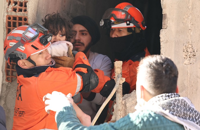 This photo provided by the Korea Disaster Relief Team shows South Korean workers rescuing a toddler in Antakya, in the Turkish province of Hatay, on Feb. 9, 2023, after a deadly 7.8 magnitude earthquake hit Turkey and Syria on Feb. 6. 