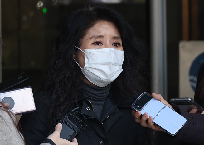 Park So-yeon, former leader of Care, speaks to reporters in front of the Seoul Central District Court on Feb. 14, 2023. (Yonhap)