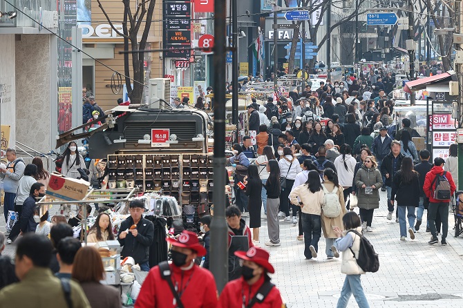 This photo, taken March 28, 2023, shows a vibrant Myeongdong district in central Seoul, a scene restored after a period of desolation due to the COVID-19 outbreak. (Yonhap)