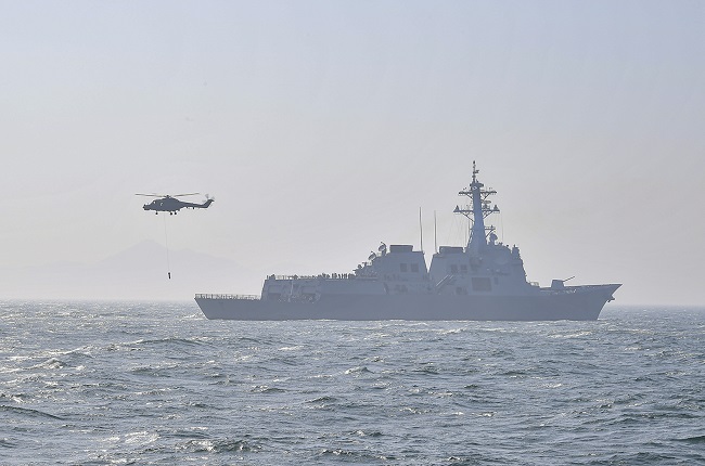 A Lynx maritime helicopter stages an anti-submarine exercise with the Sejong the Great destroyer in waters just south of Busan, 320 km southeast of Seoul, on May 16, 2023, in this photo released by the Navy on May 18.