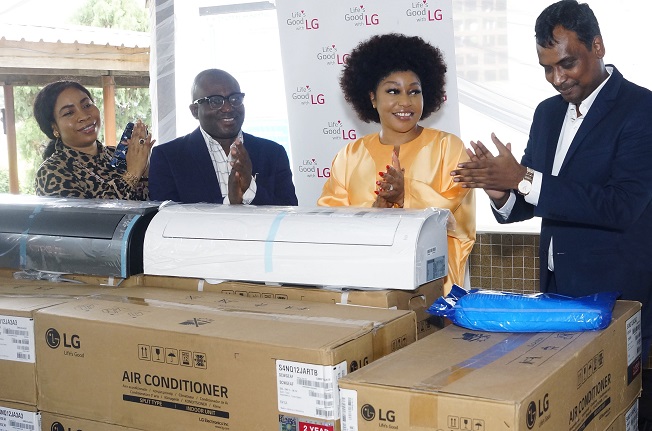 This undated file photo provided by LG Electronics shows officials from the South Korean firm's African operations and a local general hospital in Nigeria clapping after the company donated air conditioners to the hospital.
