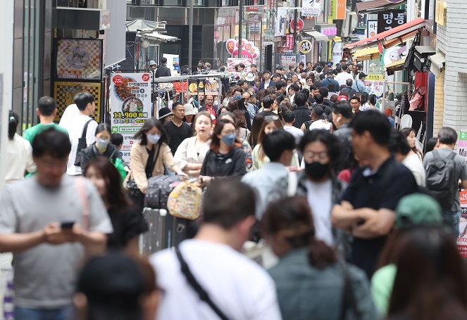 This file photo taken May 21, 2023, shows the bustling shopping district of Myeongdong in central Seoul. (Yonhap)