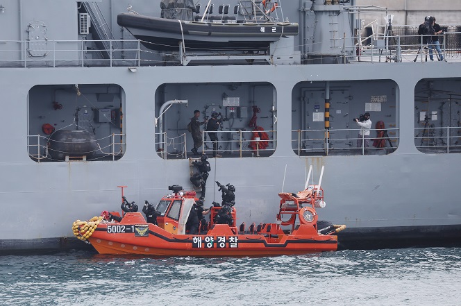 The South Korean Navy and coast guard conduct a drill to crack down on a ship suspected of carrying weapons of mass destruction in line with the Proliferation Security Initiative on seas off South Korea's southern Jeju Island on May 31, 2023. (Yonhap)