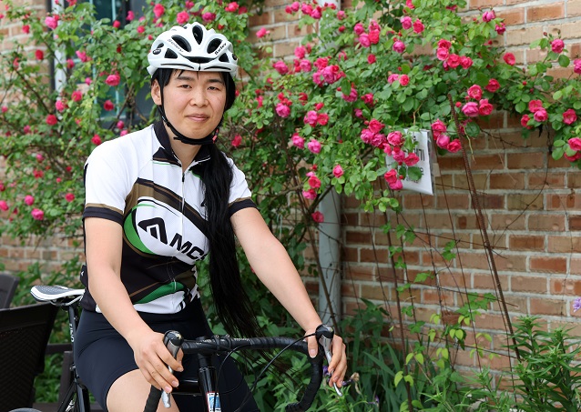 South Korean transgender cyclist Na Hwa-leen poses on her bicycle in an interview with Yonhap News Agency in Cheorwon, some 70 kilometers northeast of Seoul, on June 1, 2023. (Yonhap)