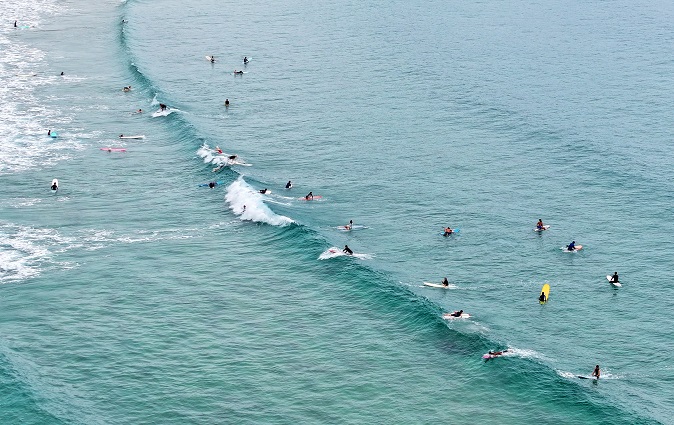This photo taken Aug. 6, 2023, shows a number of surfers enjoying the water at Jukdo Beach in Yangyang, northeastern South Korea. (Yonhap)