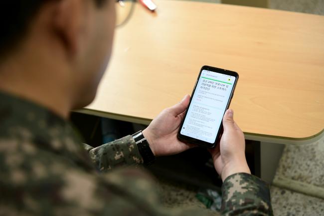 Controversy has arisen over the extent to which soldiers can use cell phones in their barracks. (Image from Korea.gov)