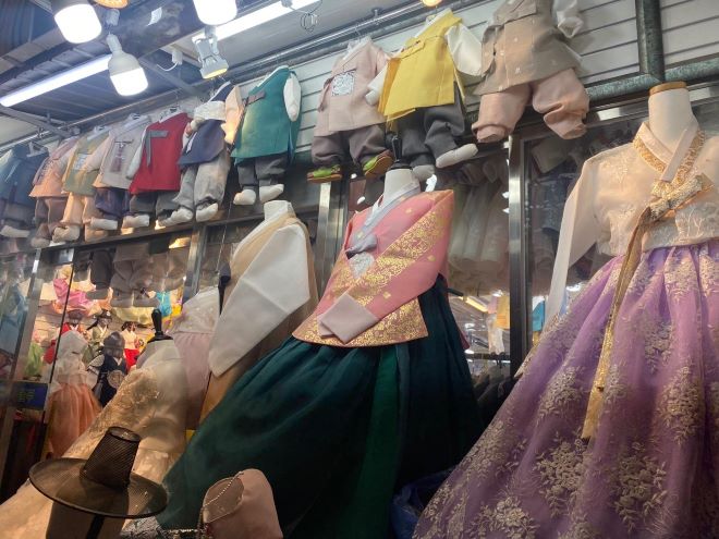 Colorful hanboks are laid out in front of a hanbok shop at Gwangjang Market in Jongno-gu, Seoul, on Feb. 7, ahead of the Lunar New Year holiday. (Image courtesy of Hanbok)