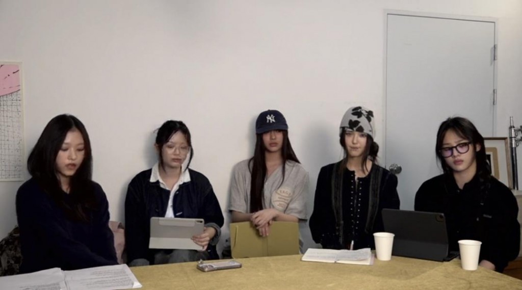 This captured image shows NewJeans members in their YouTube livestream on Sept. 11, 2024. (Yonhap)