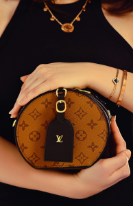Woman Holding a Louis Vuitton Bag (Image courtesy of Pexels/CCL)