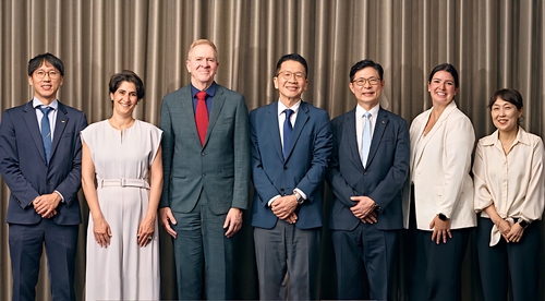 In this photo provided by SK bioscience Co., Trevor Mundel (3rd from L), president of Global Health at the Gates Foundation; Chey Chang-won (4th from L), vice chairman of SK discovery; and Ahn Jae-yong (5th from L), CEO of SK bioscience, pose with other officials after a meeting on global health projects in Seoul. (Yonhap)