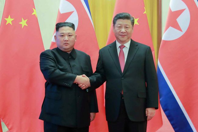 North Korean leader Kim Jong-un (L) shakes hands with Chinese President Xi Jinping during their summit meeting in Pyongyang on June 20, 2019, in this file photo published by the Korean Central News Agency. (Yonhap)
