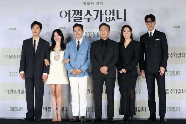 The cast of Park Chan-wook's "No Other Choice" poses for photos at a press conference in Seoul on Aug. 19, 2025. (Image courtesy of Yonhap)