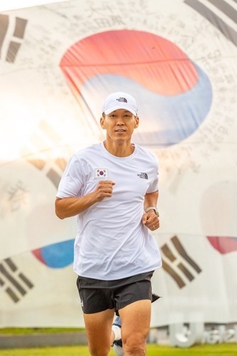 Singer Sean participates in a charity run marking Liberation Day. (Image provided by YG Entertainment)
