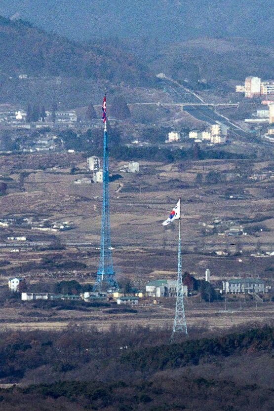 From the border area in Paju, Gyeonggi Province, the South Korean flag in Daeseong-dong and the North Korean flag in Kijŏng-dong face each other across the western sector of the Demilitarized Zone. (Yonhap)
