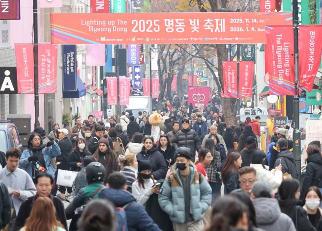 Myeongdong Street in central Seoul, a popular shopping district, is bustling with people in this Nov. 25, 2025, file photo. (Yonhap)