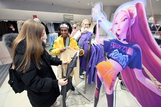 Foreign tourists browse K-Pop Demon Hunters collaboration merchandise at an Eight Seconds store in Myeongdong, Seoul. (Yonhap)